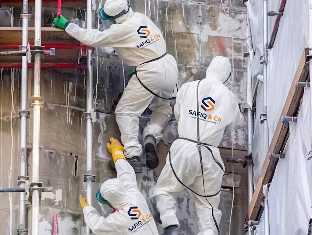 Technician safely removing asbestos sheeting